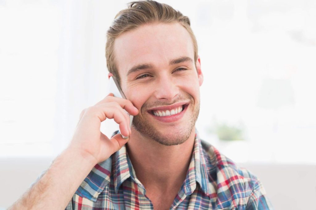 Contact-GRND-Demolition-and-Excavation-Toronto Male receptionist attending to a client over the phone
