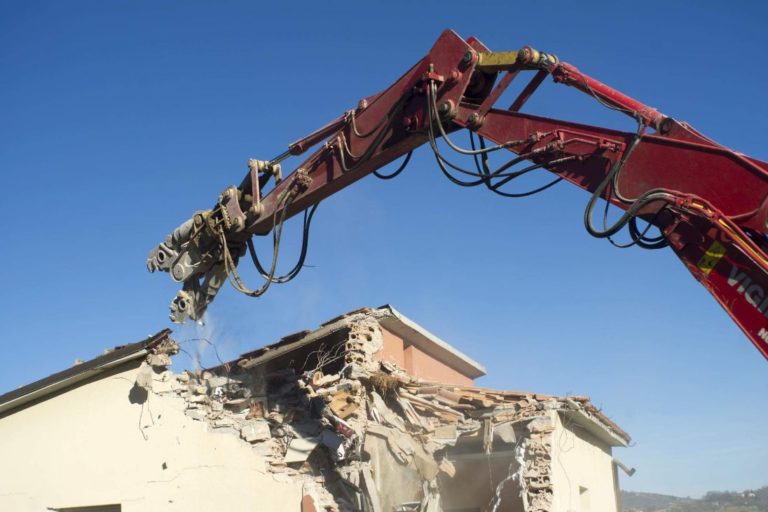 Residential Demolition by a concrete cutting machine