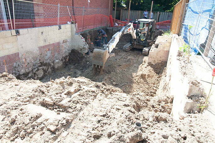 Excavation Toronto, ON Digging and leveling the ground with an excavator on a residential excavation site in Toronto, ON