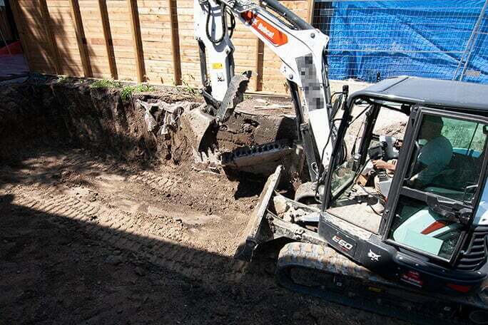 concrete block removal with an excavator