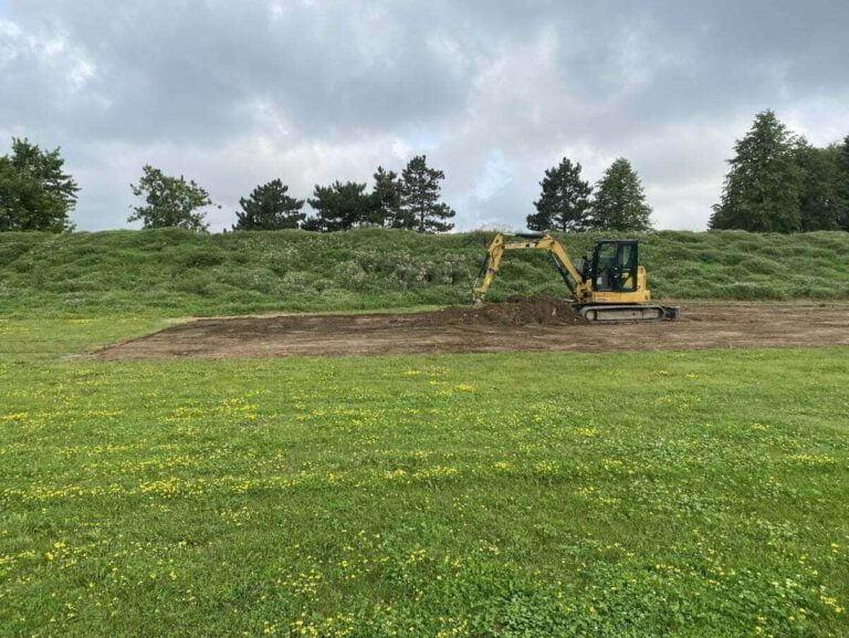 land clearing with a small excavator in preparation for future construction