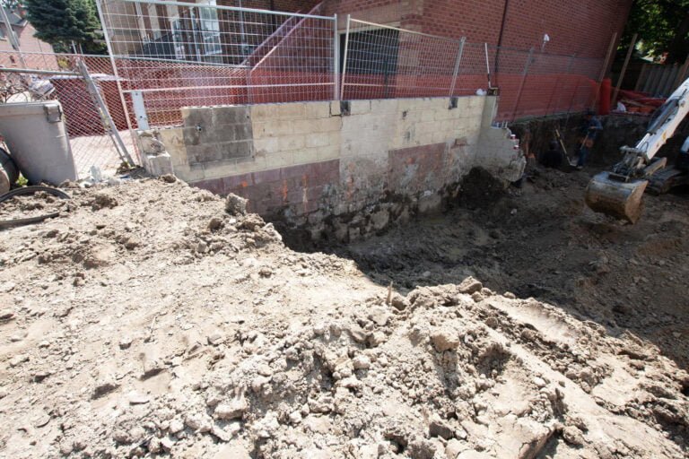 preparing the foundation for future construction with an excavator