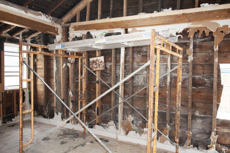 scaffolding to reach higher places of a residential property during interior demolition
