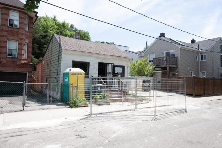 residential demolition project in toronto before the work started, demolition permits posted on the windows of the property