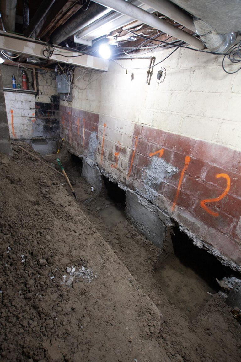 several basement underpinning holes that were dug out with shovels