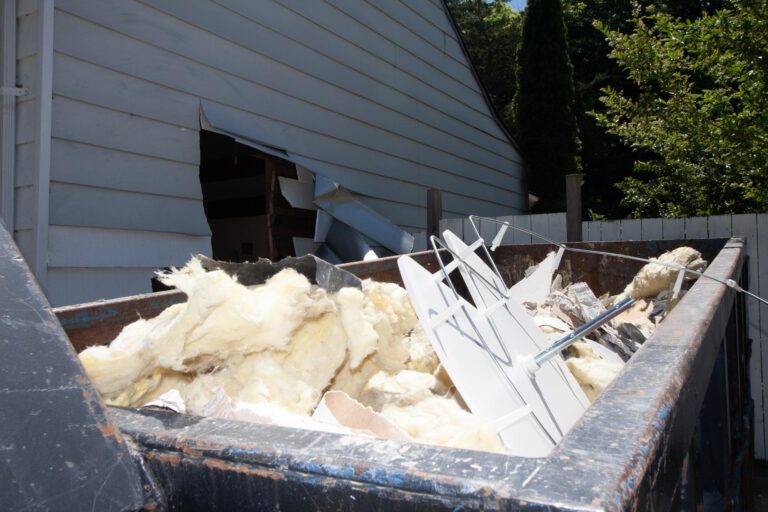 bin with mostly insulation debris from an interior demolition
