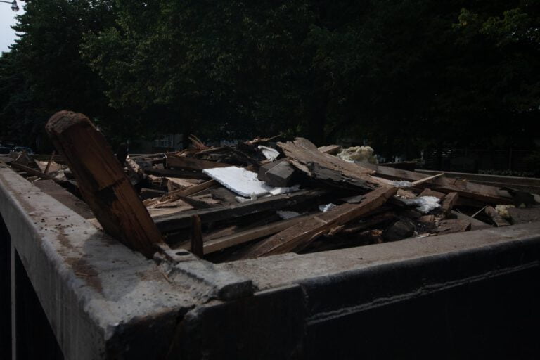 one of our bins that is filled with wood material, ready to be picked up and moved