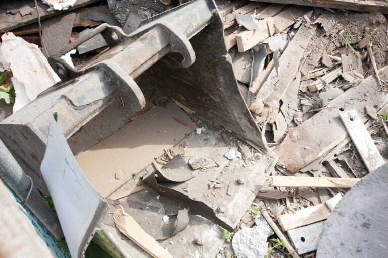excavator bucket attachment for waste removal